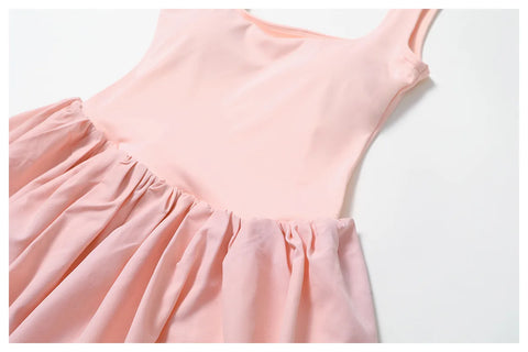 Close up of the sleeveless Rinay Sport Dress. Image shows the gathered waist seam and soft fabric drapes.