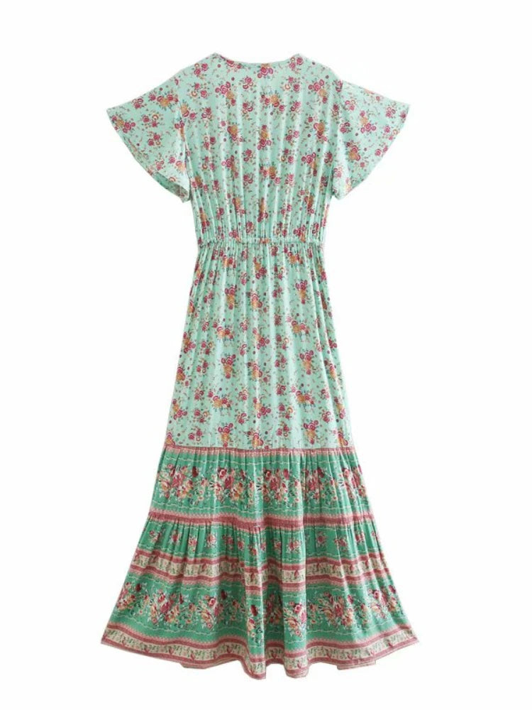 Birdie Summer Midi Dress from Shop the Kei - back view of a bohemian styled dress with flower print, v neck button closure, adjustable waist tie, soft natural textile and texture, and flounce hem on white background.