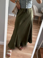 Bela Satin Maxi Skirt from Shop the Kei - close up of drawstring waistband flare hemline. Pairs well with denim top and tan sandals