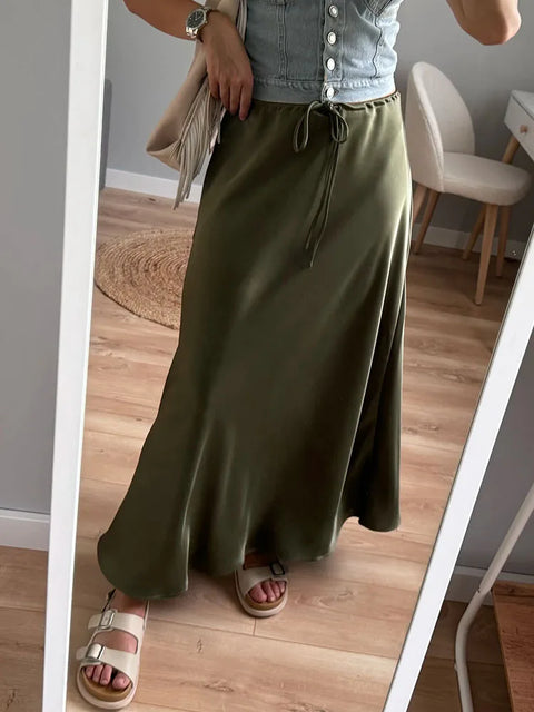 Bela Satin Maxi Skirt from Shop the Kei - close up of drawstring waistband flare hemline. Pairs well with denim top and tan sandals