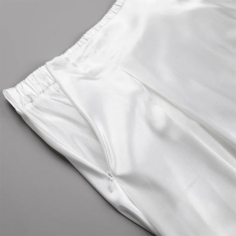 Amber Satin Maxi Skirt from Shop the Kei - close up of side zipper closure, front pleats, backstretch waistband, lining, and satin textile texture