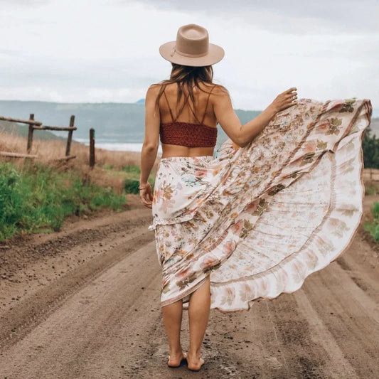 True Boho Floral Midi Skirt from Shop The Kei - flowing white floral midi skirt with elastic waistband and ruffled hem, made of natural fibers. Pairs well with crochet tops and bikini tops in white, pink, blue, or green