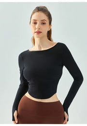 Eden Seamless Cross Back Top from Shop the Kei - front view of athletic apparel soft and breathable long sleeve top. Dancer inspired style pairs well with yoga pants