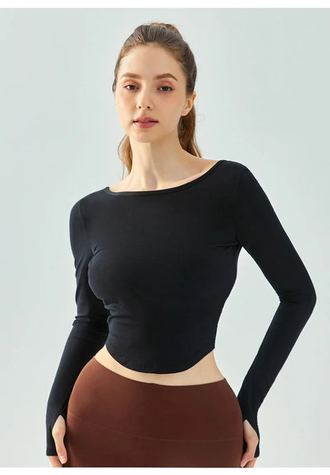 Eden Seamless Cross Back Top from Shop the Kei - front view of athletic apparel soft and breathable long sleeve top. Dancer inspired style pairs well with yoga pants