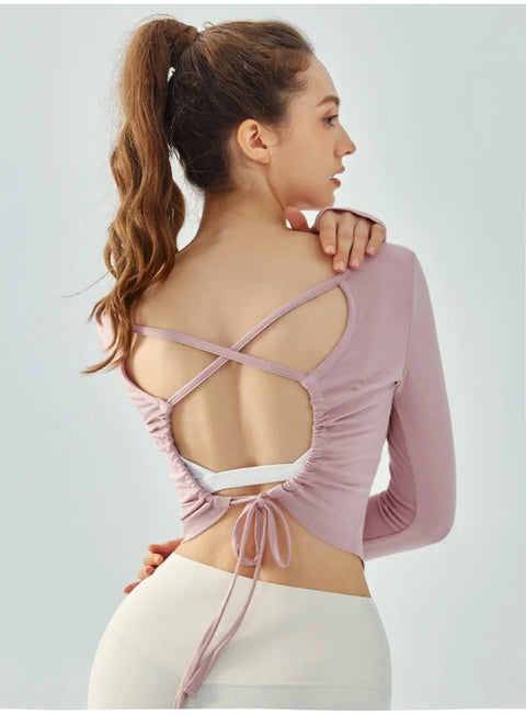 Eden Seamless Cross Back Top from Shop the Kei - back view of soft and breathable dancer inspired long sleeve top with adjustable back straps that tie at the hem. Pairs well with yoga pants.