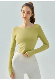 Eden Seamless Cross Back Top from Shop the Kei - front view of athletic apparel soft and breathable long sleeve top. Dancer inspired style pairs well with yoga pants