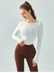 Eden Seamless Cross Back Top from Shop the Kei - front view of athletic apparel soft and breathable long sleeve top. Dancer inspired style pairs well with yoga pants