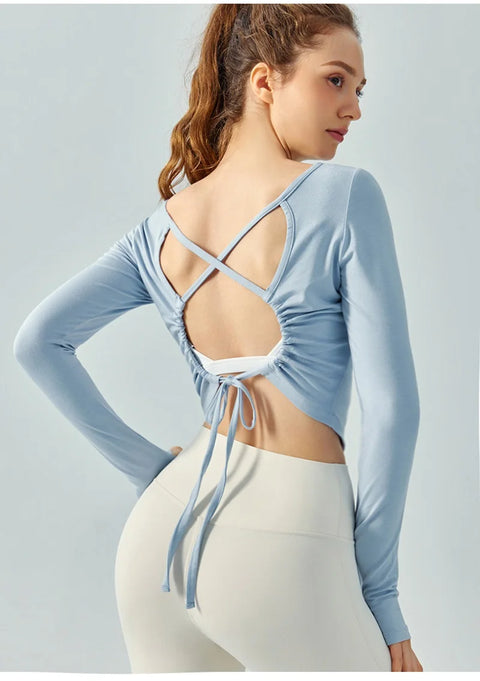 Eden Seamless Cross Back Top from Shop the Kei - back view of soft and breathable dancer inspired long sleeve top with adjustable back straps that tie at the hem. Pairs well with yoga pants.