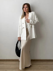 Bela Satin Maxi Skirt from Shop the Kei - side view - satin maxi skirt with drawstring waist and flare hem. Lux outfit skirt pairs well with a Gucci bag and a blazer