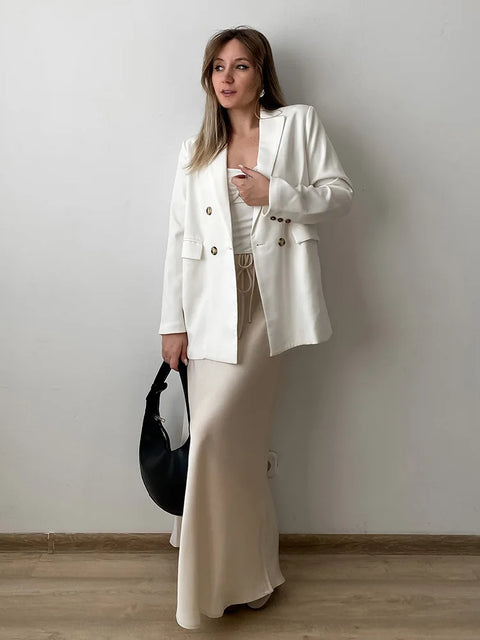 Bela Satin Maxi Skirt from Shop the Kei - side view - satin maxi skirt with drawstring waist and flare hem. Lux outfit skirt pairs well with a Gucci bag and a blazer