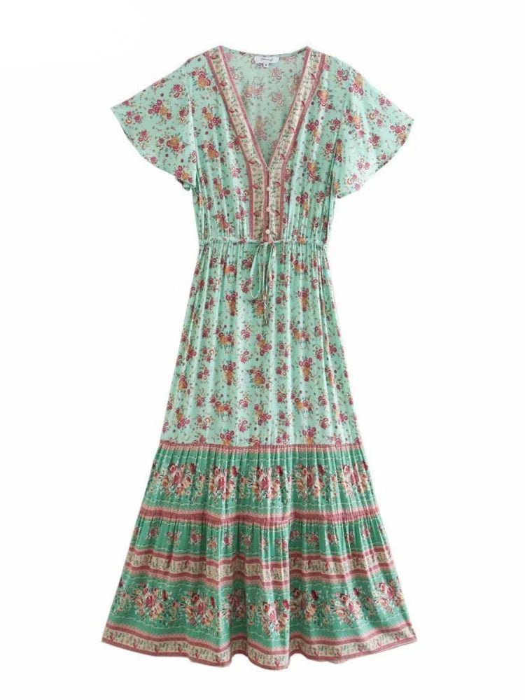 Birdie Summer Midi Dress from Shop the Kei - front view of a green sprout color option featuring a bohemian styled dress with flower print, v neck button closure, adjustable waist tie, soft natural textile and texture, and flounce hem on white background