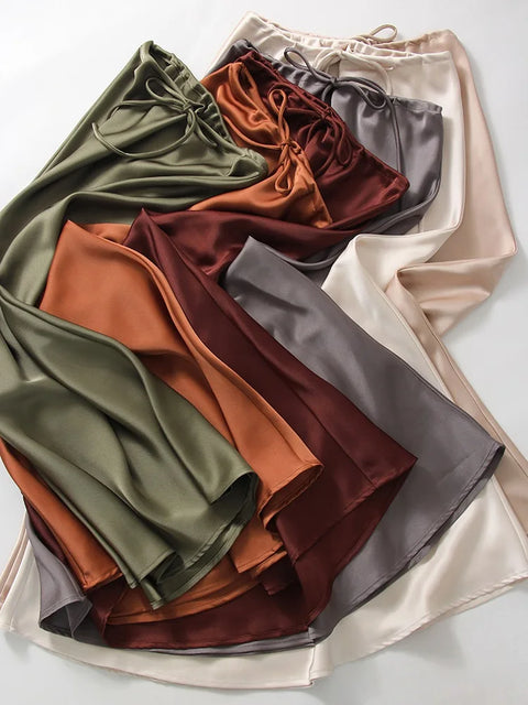 Bela Satin Maxi Skirt from Shop the Kei - full length view - available in rich earth tones: ivory, white, gray, dark red, orange, and green.