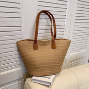 Natural tan color straw bag with brown faux leather straps 