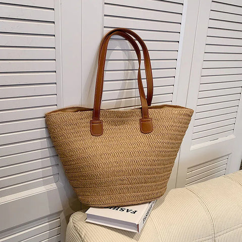 Natural tan color straw bag with brown faux leather straps 