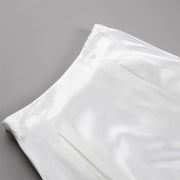 Amber Satin Maxi Skirt from Shop the Kei - close up of flat front waistband, pleats, and satin textile texture