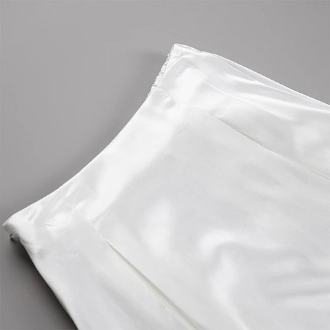 Amber Satin Maxi Skirt from Shop the Kei - close up of flat front waistband, pleats, and satin textile texture