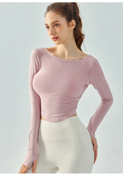 Eden Seamless Cross Back Top from Shop the Kei - front view of athletic apparel soft and breathable long sleeve top. Dancer inspired style pairs well with yoga pants