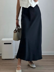Bela Satin Maxi Skirt from Shop the Kei - black bias fitting skirt. Pairs well with a white top and flats