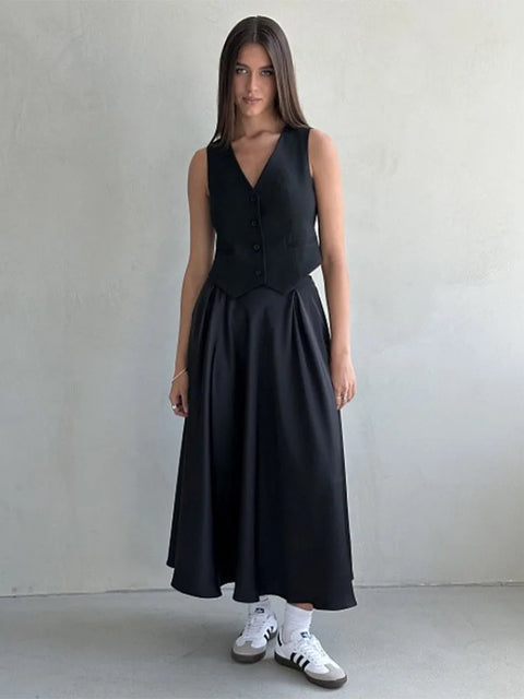 Amber Satin Maxi Skirt from Shop the Kei - flowing black satin maxi skirt with high waist and flare hem. Pairs well with a black top. Preppy goth style