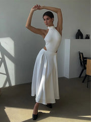 Amber Satin Maxi Skirt from Shop the Kei - flowing ivory white satin maxi skirt with high waist and flare hem. Pairs well with matching body suit turtleneck. Dancer style long circle skirt