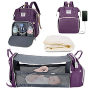Purple baby diaper backpack shown in multiple views: with bottle storage compartment open, with USB charging port, folded mattress insert, and fully expanded as bassinet with mesh sides containing a baby. Lotus 3-in-1 bassinet diaper bag travel system with partial canopy