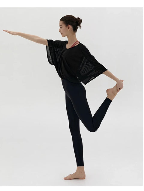 Veda Butterfly Top from Shop the Kei -  side view of the black color option loose fitting dancer inspired activewear top. Short wide sleeves are flattering and breathable.