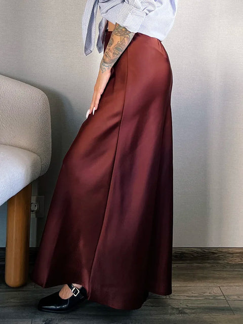 Bela Satin Maxi Skirt from Shop the Kei - side view - satin maxi skirt with drawstring waist and flare hem. Elegant date night skirt pairs well with black heels