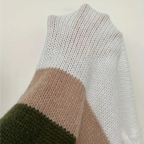 Knitted sweater with color-block design on a plain background