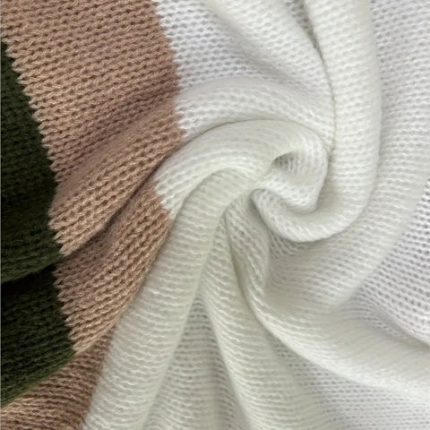Close-up of textured fabric in beige, brown, and white.