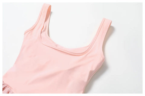 Close up of the Rinay Sport Dress. Image shows the back neckline and topstitch construction