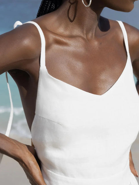 Isla Summer Dress from Shop the Kei - Close up front view of the soft white linen dress v neckline, showcases the nice construction and fit of the dress