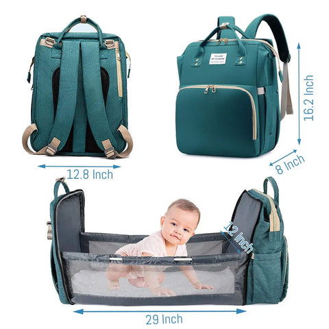 Green baby diaper backpack shown in multiple views: with dimensions 12.8 in wide by 8 in depth by 16.2 inch height. Bassinet extends 29 inches long by 12 inches depth. Lotus 3-in-1 bassinet diaper bag travel system with partial canopy