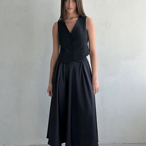 Amber Satin Maxi Skirt from Shop the Kei - flowing black satin maxi skirt with high waist and flare hem. Pairs well with a black top. Luxury goth style