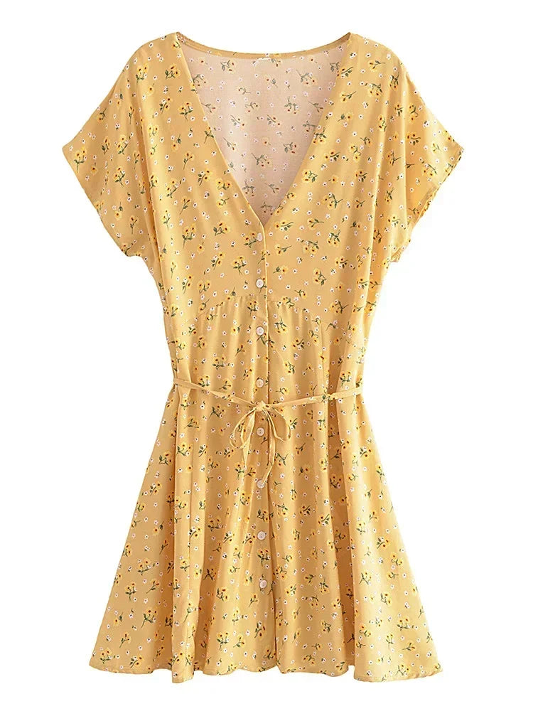 Nyla Flutter Mini Dress from Shop the Kei - front view of flowing yellow and white floral short dress on white background