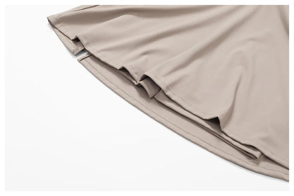 Close view of the Bree Yoga Dress in dark linen color. Highlights the smooth, light knit fabric texture