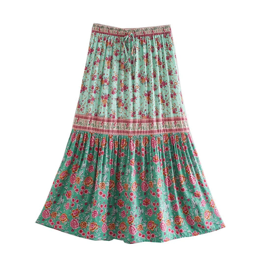 Birdie Summer Midi Skirt from Shop The Kei - mint floral skirt with ivory border prints features pink and orange flower pattern displayed on plain white background.