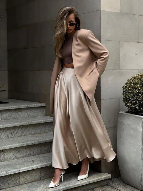 Amber Satin Maxi Skirt from Shop the Kei - flowing satin maxi skirt with hight waist and flare hem. Pairs well with neutral colors. Romantic date night skirt.