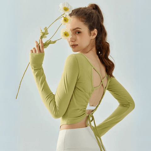 Eden Seamless Cross Back Top from Shop the Kei - athletic apparel soft and breathable long sleeve top with adjustable back straps that tie at the hem. Dancer inspired style pairs well with a flowy white skirt