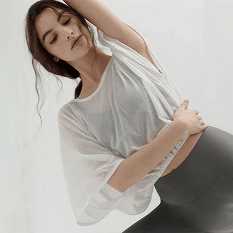 Veda Butterfly Top from Shop the Kei -  featuring a loose fitting dancer inspired design that flows and flexes with your workout movements. Elastic waist creates an accentuating shape.