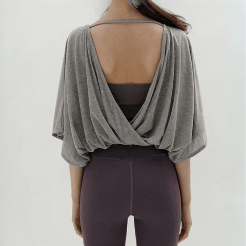 Veda Butterfly Top from Shop the Kei -  back view of the gray color option wrap hemline can also be worn to the front and over a cute sports bra or body suit.