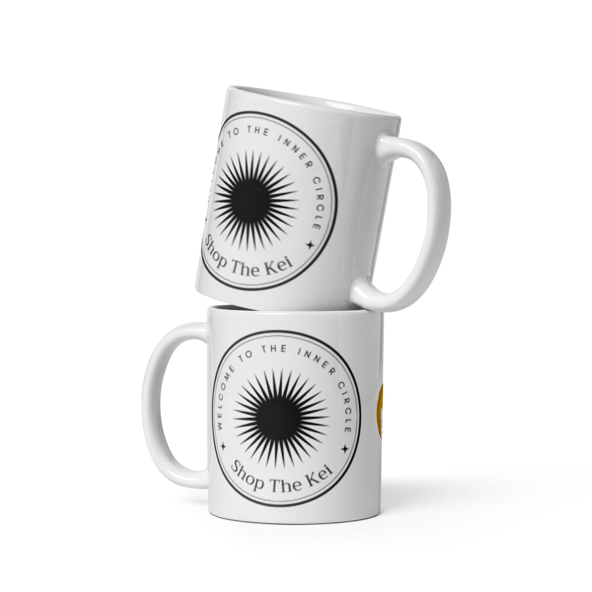 Two Inner Circle Mugs stacked, showing the black sunburst emblem and Shop The Kei wordmark