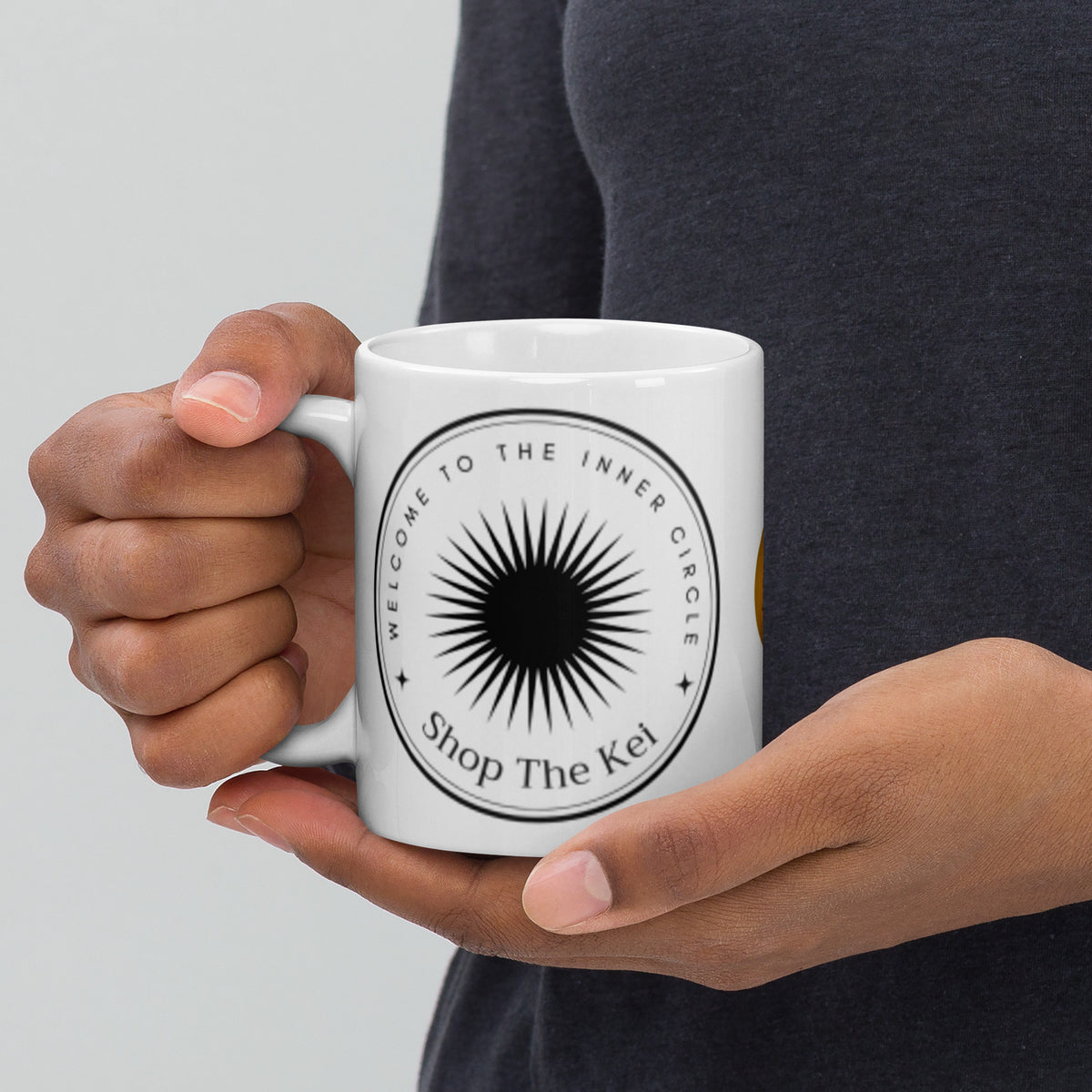 Woman holding the Inner Circle Mug in both hands