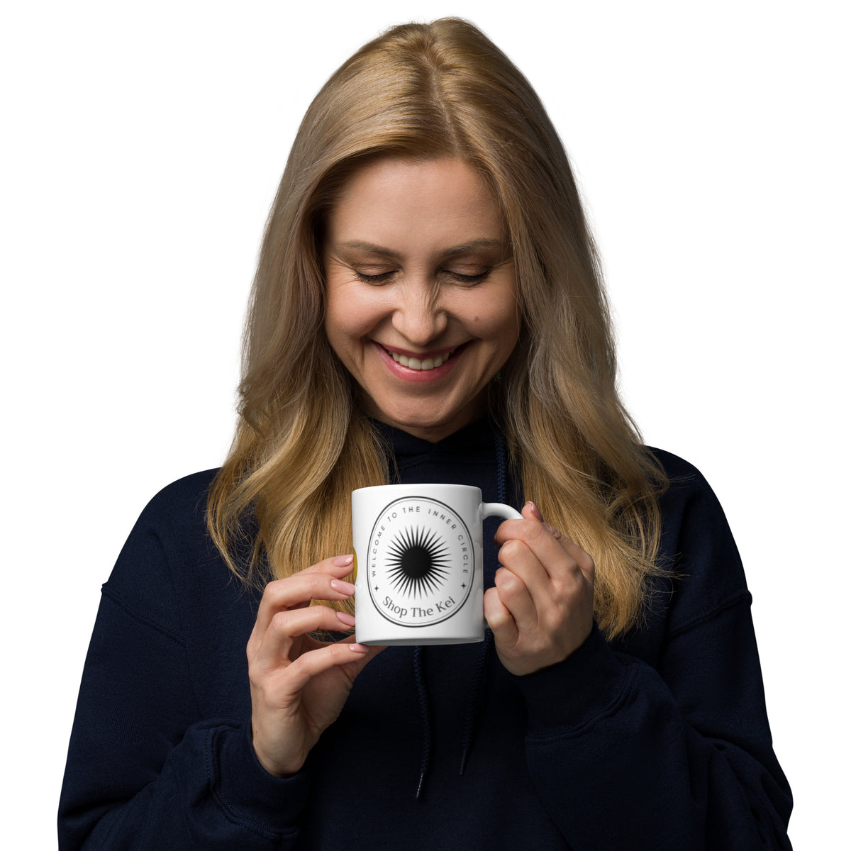 Smiling woman looking down at the Inner Circle Mug held in both hands