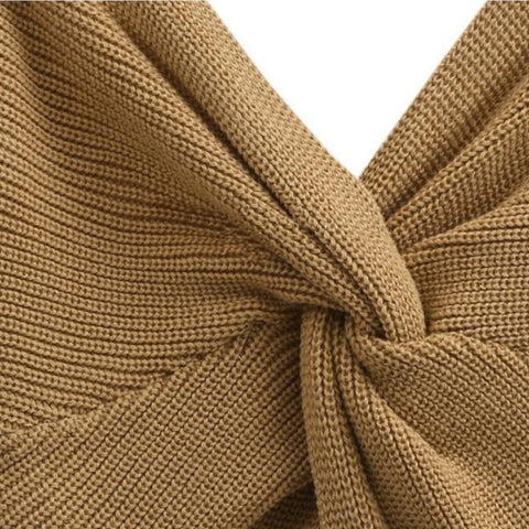 Close up view of caramel colored Aries Sweater from Shop The Kei. Reveals the sweater's textured rib knit pattern and relaxed, versatile styling.