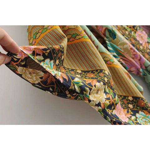 Close up view of Nyma Kimono from Shop The Kei swim collection. Image depicts the intricate print details and natural textile texture of the sleeve