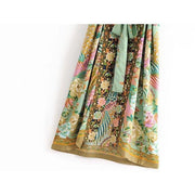 Close up view of Nyma Kimono from Shop The Kei swim collection. Image depicts the intricate print details and natural textile texture of the hem details