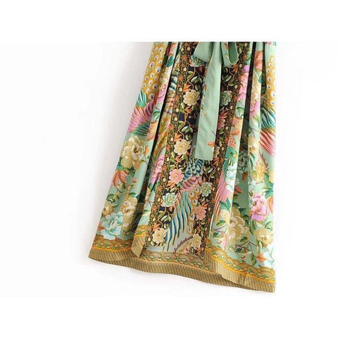 Close up view of Nyma Kimono from Shop The Kei swim collection. Image depicts the intricate print details and natural textile texture of the hem details