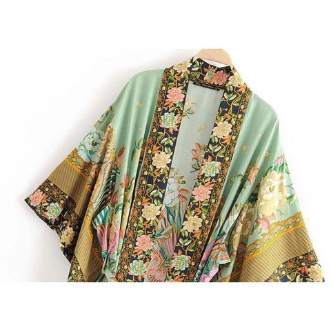 Close up view of Nyma Kimono from Shop The Kei swim collection. Image depicts the intricate print details and natural textile texture of the front details