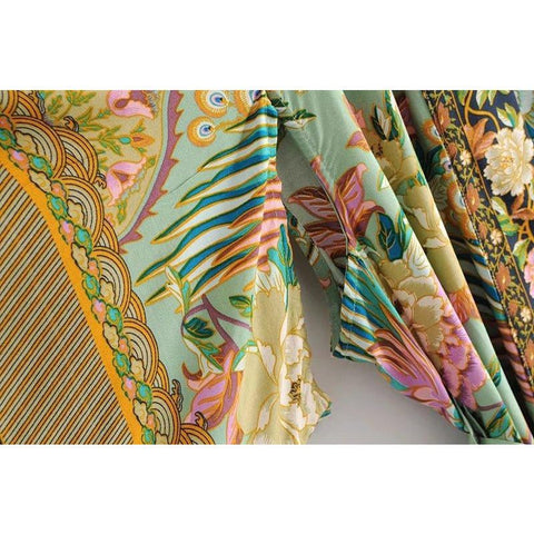 Close up view of Nyma Kimono from Shop The Kei swim collection. Image depicts the intricate print details and natural textile texture of the sleeve