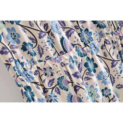 Nala Midi Dress from Shop The Kei - close up detail of gathered waistline, blue and purple floral boho print colors and natural textile textures